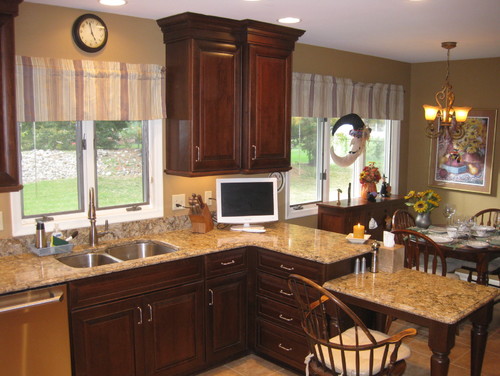 Cambria Buckingham with Split Level Countertop, Travertine Flooring and Dark Tone Cabinets